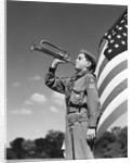 1950s profile of boy scout in uniform standing in front of 48 star american flag blowing bugle by Anonymous