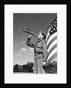 1950s profile of boy scout in uniform standing in front of 48 star american flag blowing bugle by Anonymous