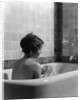 1920s 1930s woman sitting in bath tub by Anonymous