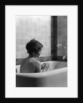 1920s 1930s woman sitting in bath tub by Anonymous