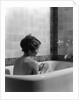 1920s 1930s woman sitting in bath tub by Anonymous