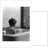 1920s 1930s woman sitting in bath tub by Anonymous