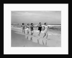 1930s four women and one man running on beach holding hands by Anonymous