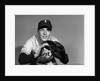 1950s baseball player with glove poised to catch ball keeping his eye on the ball by Anonymous