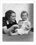 1930s smiling mother and happy child looking at camera by Anonymous