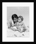 1920s 1930s woman mother lying sitting with baby on blanket by Anonymous