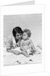 1920s 1930s woman mother lying sitting with baby on blanket by Anonymous