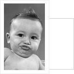 1950s baby making a funny face and bronx cheer noise looking at camera by Anonymous