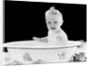 1930s 1940s smiling happy baby sitting in enameled tin bathtub by Anonymous