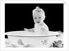 1930s 1940s smiling happy baby sitting in enameled tin bathtub by Anonymous