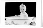 1930s 1940s smiling happy baby sitting in enameled tin bathtub by Anonymous