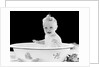 1930s 1940s smiling happy baby sitting in enameled tin bathtub by Anonymous