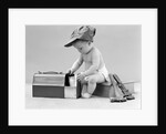 1940s baby in railroad engineer hat pulling milk bottle from lunch pail with hammer & wrench tools at side studio by Anonymous