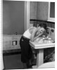 1930s boy washing face at bathroom sink by Anonymous