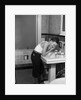 1930s boy washing face at bathroom sink by Anonymous