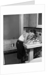 1930s boy washing face at bathroom sink by Anonymous