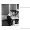 1930s boy washing face at bathroom sink by Anonymous