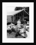 1950s family grilling hamburgers beside pool in backyard cookout by Anonymous