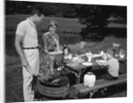 1950s family picnic bar-b-cue mom dad children by Anonymous