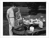 1950s family picnic bar-b-cue mom dad children by Anonymous