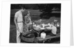 1950s family picnic bar-b-cue mom dad children by Anonymous