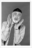 1990s character portrait man gray beard wearing yarmulke hebrew jewish skullcap hands up to face gesture funny expression oy looking at camera by Anonymous
