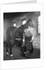 1930s elderly bearded blacksmith shoeing horse holding hoof between legs & hammer in other hand by Anonymous
