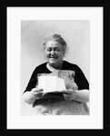 1930s 1940s elderly character woman smiling reading letter wearing apron looking at camera by Anonymous