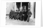 1920s 1930s group of old men in hats & dungarees sitting on bench in front of store window looking at camera by Anonymous