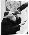 1930s old astronomer white hair and beard wearing skull cap looking through telescope by Anonymous