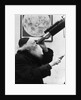 1930s old astronomer white hair and beard wearing skull cap looking through telescope by Anonymous