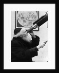 1930s old astronomer white hair and beard wearing skull cap looking through telescope by Anonymous