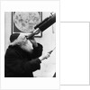 1930s old astronomer white hair and beard wearing skull cap looking through telescope by Anonymous
