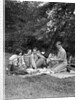 1920s four people two couples men women sitting on ground enjoying a picnic by Anonymous