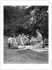 1920s four people two couples men women sitting on ground enjoying a picnic by Anonymous