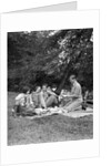 1920s four people two couples men women sitting on ground enjoying a picnic by Anonymous