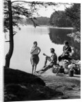 1920s 1930s 3 people picnicking by onata lake man wearing jodhpurs standing two seated women berkshires ma usa by Anonymous