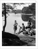 1920s 1930s 3 people picnicking by onata lake man wearing jodhpurs standing two seated women berkshires ma usa by Anonymous