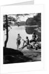1920s 1930s 3 people picnicking by onata lake man wearing jodhpurs standing two seated women berkshires ma usa by Anonymous