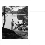 1920s 1930s 3 people picnicking by onata lake man wearing jodhpurs standing two seated women berkshires ma usa by Anonymous