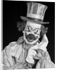 1950s portrait of clown wearing top hat smiling looking at camera by Anonymous