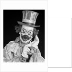 1950s portrait of clown wearing top hat smiling looking at camera by Anonymous