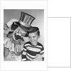 1950s smiling clown with top hat arm around grinning boy in striped shirt by Anonymous