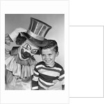 1950s smiling clown with top hat arm around grinning boy in striped shirt by Anonymous
