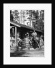 1920s 1930s couple in front of log cabin woman sitting on porch railing man on horse alberta canada by Anonymous