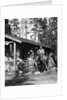 1920s 1930s couple in front of log cabin woman sitting on porch railing man on horse alberta canada by Anonymous