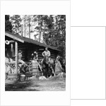 1920s 1930s couple in front of log cabin woman sitting on porch railing man on horse alberta canada by Anonymous