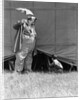 1930s man clown catching little boy peeking under circus big top tent by Anonymous