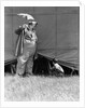 1930s man clown catching little boy peeking under circus big top tent by Anonymous