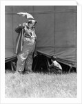 1930s man clown catching little boy peeking under circus big top tent by Anonymous